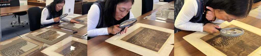 J.J. Cheng inspecting an archived university photo of her grandfather's class